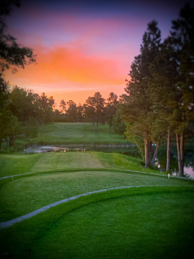 Sunset over the tee box and pond