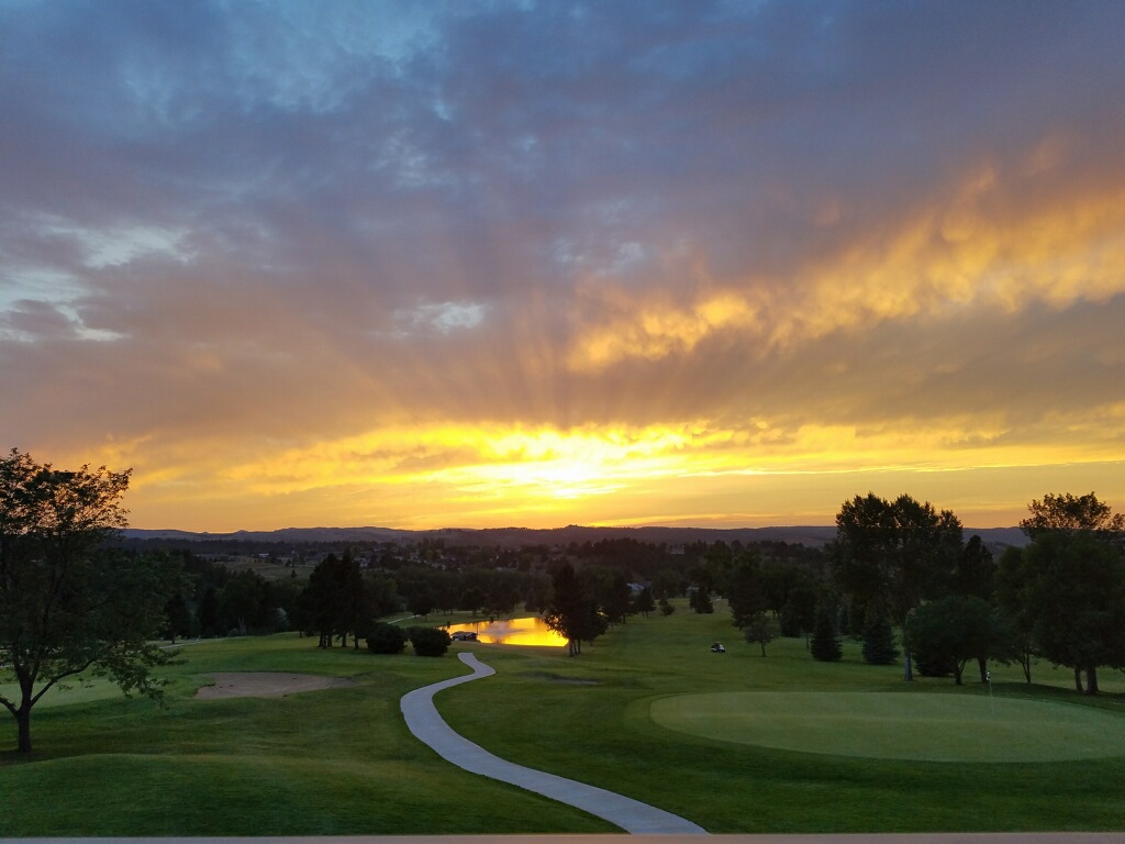 Sunrise over the course and pond